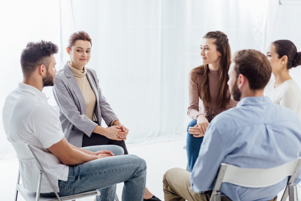 Patients in a group therapy session during the Partial Hospitalization Program in Florida